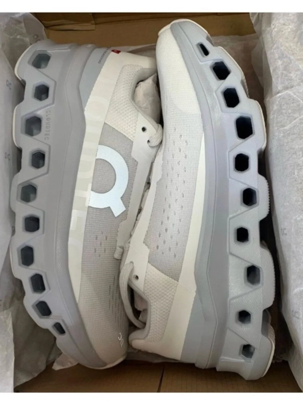 On Running Women’s athletic shoes in White and Light Gray